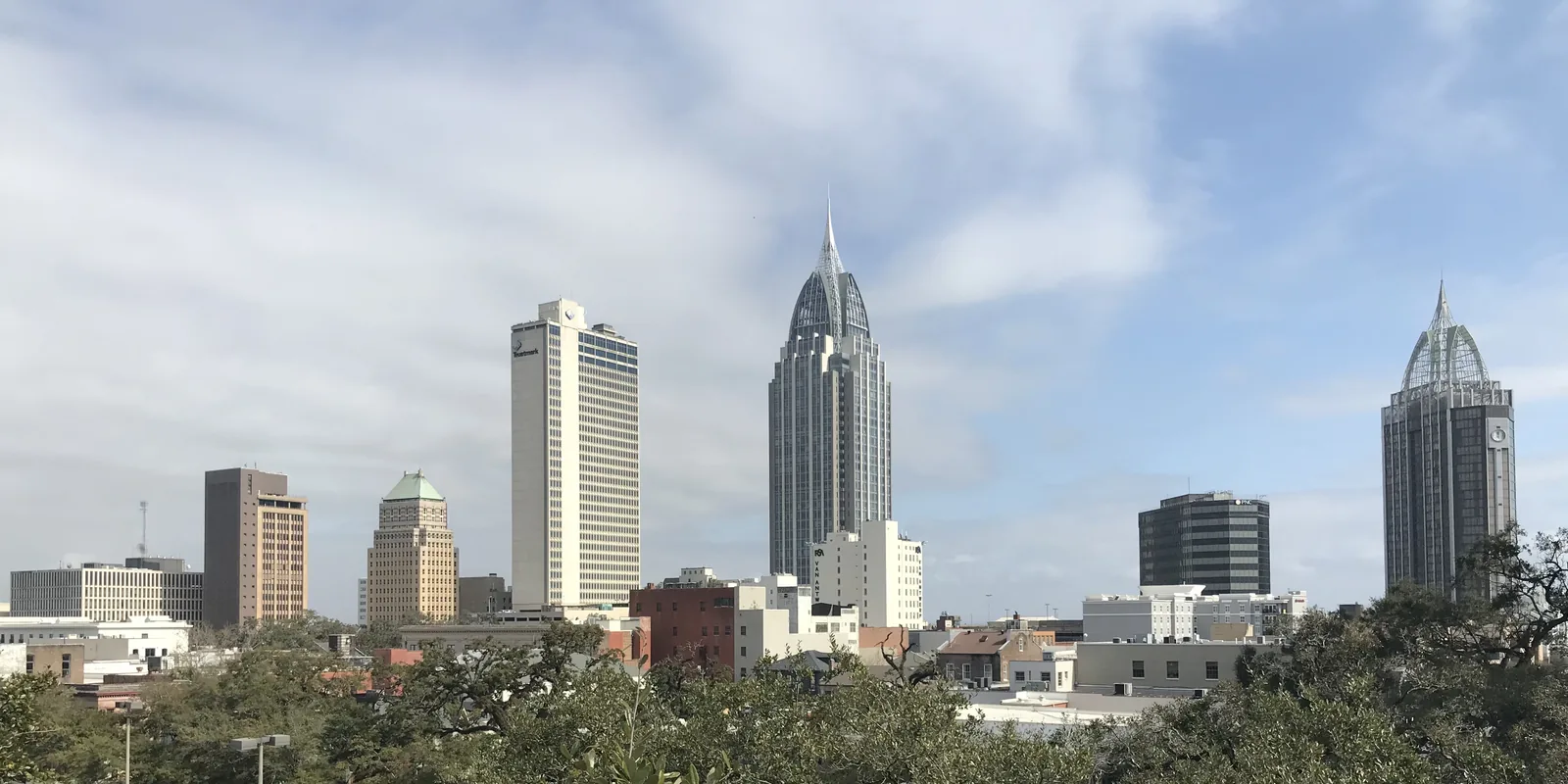 Downtown Mobile, Alabama skyline, where sellers compare the best ways to sell a house for cash