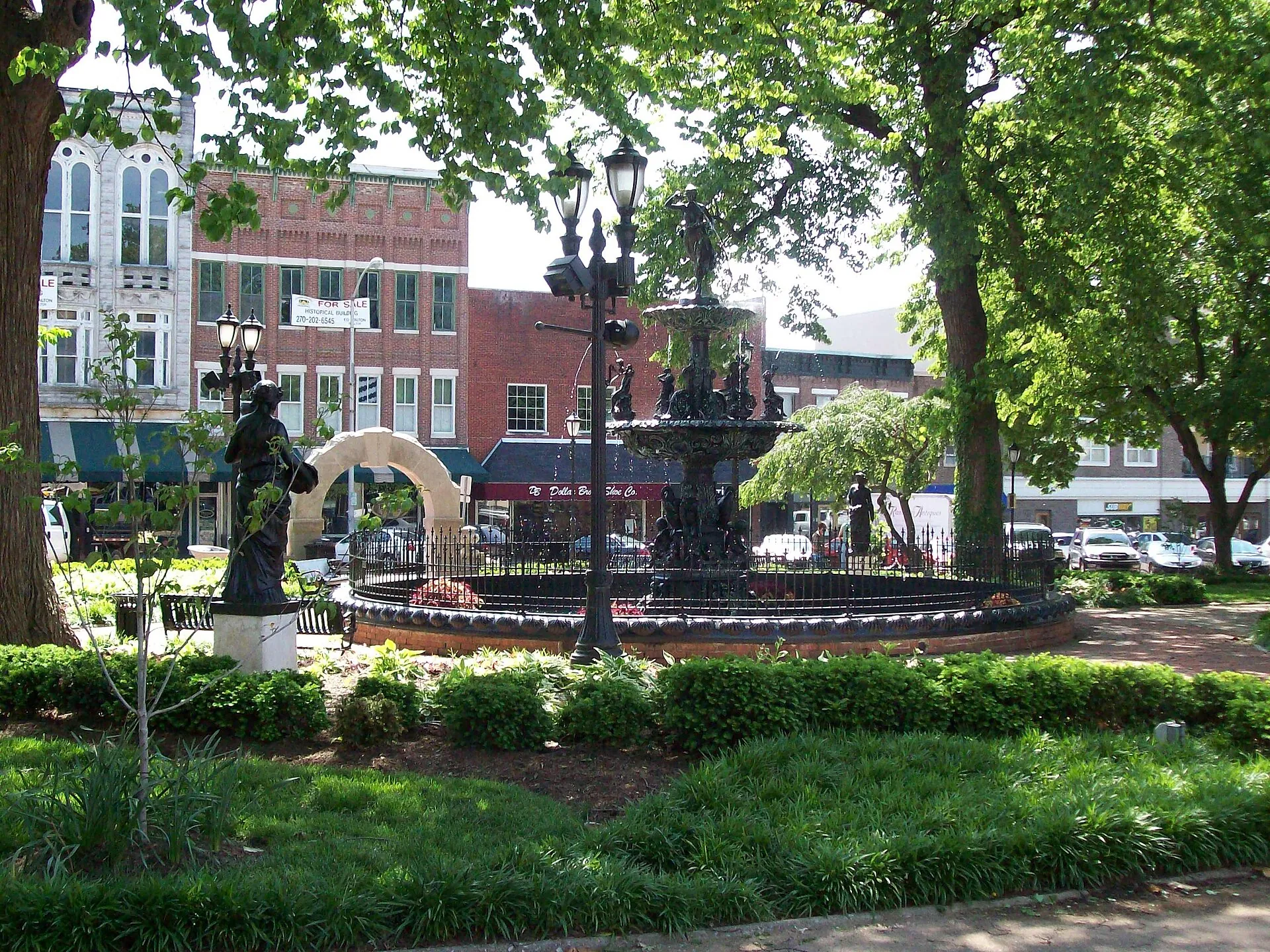 The cast-iron fountain and shade trees of Fountain Square Park in downtown Bowling Green, Kentucky