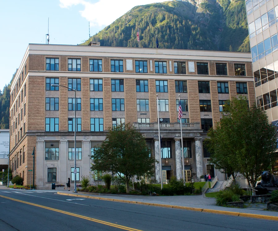 Alaska State Capitol in downtown Juneau with Mount Juneau behind