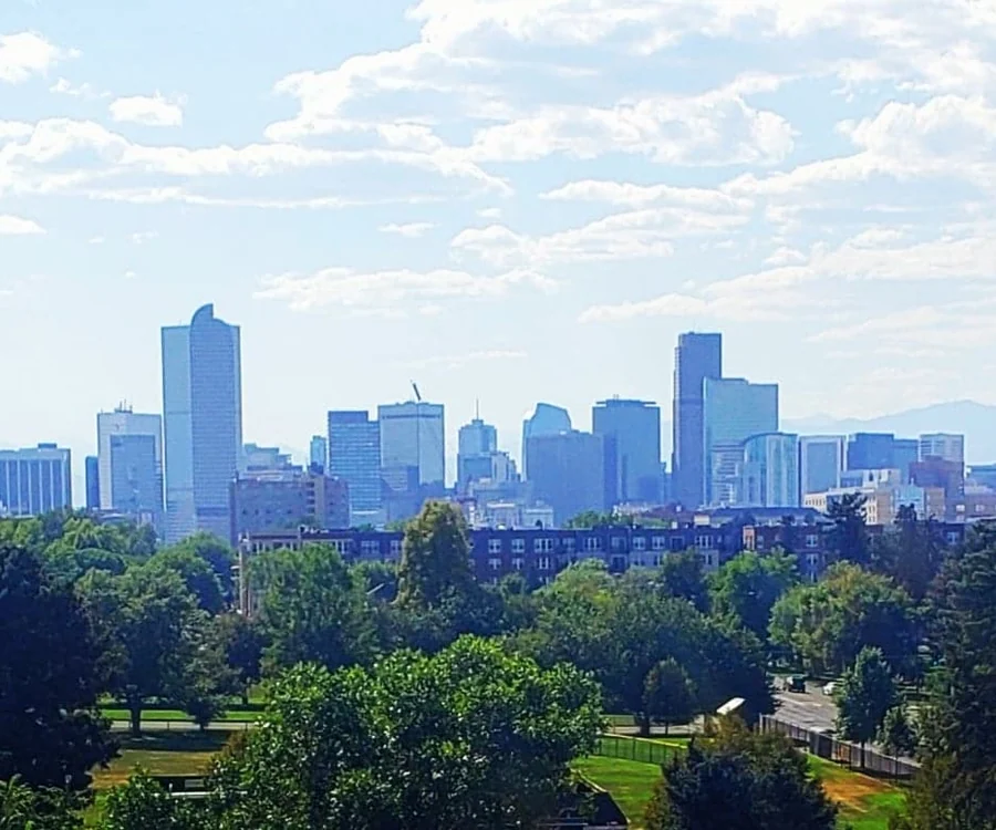 The Denver skyline seen from City Park, southeast of the Berkeley neighborhood where Propcash buys older bungalows for cash.