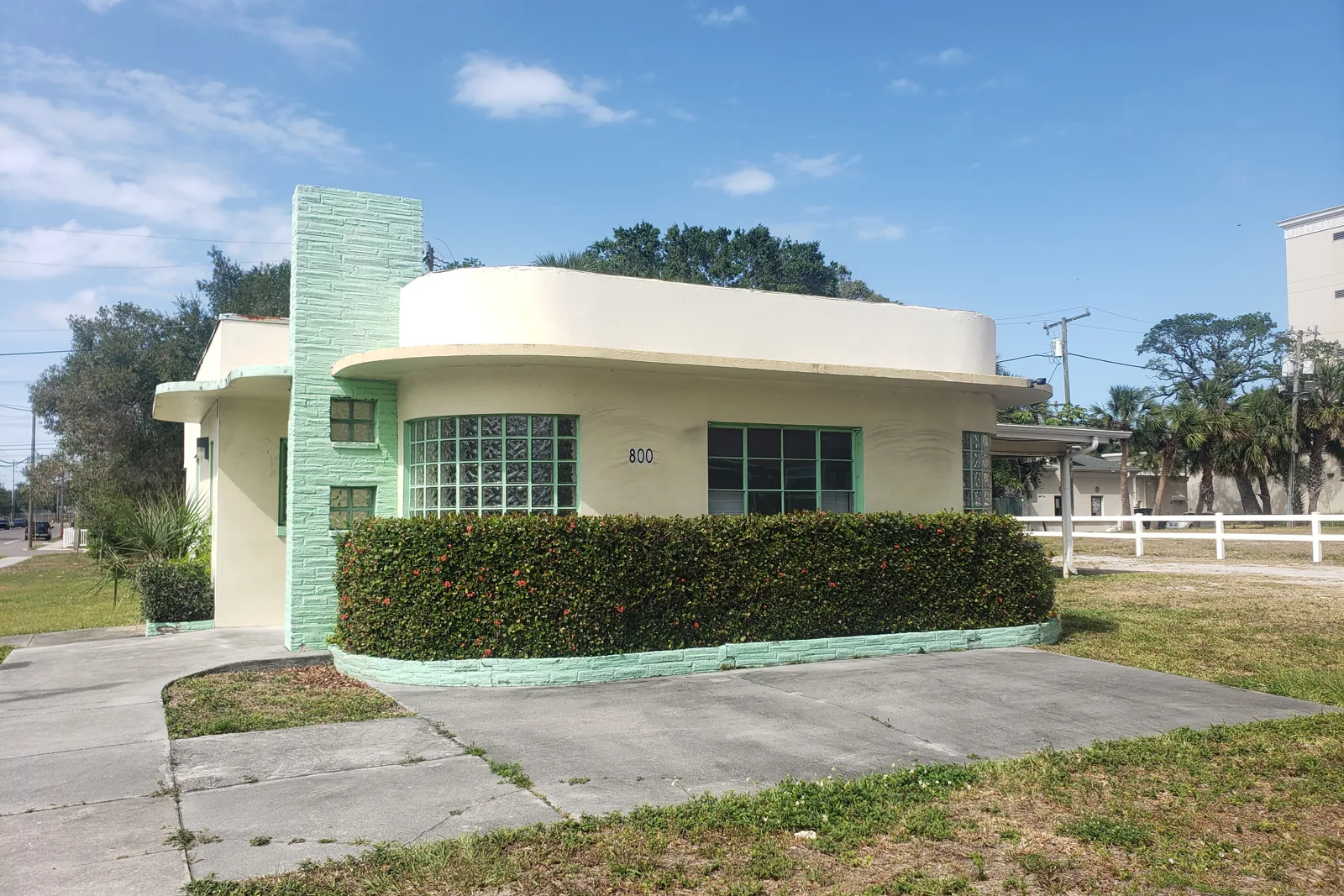 Streamline Moderne house with glass block windows and a green tile chimney on East Strawbridge Avenue in Melbourne