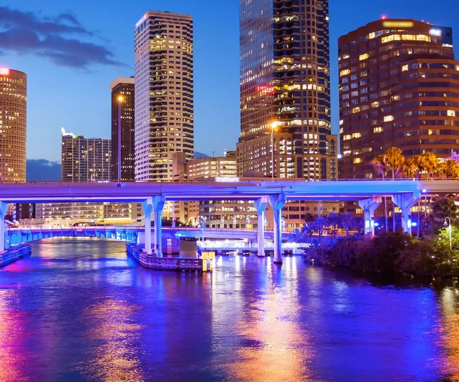Downtown Tampa Bay Florida skyline along the Hillsborough River at dusk