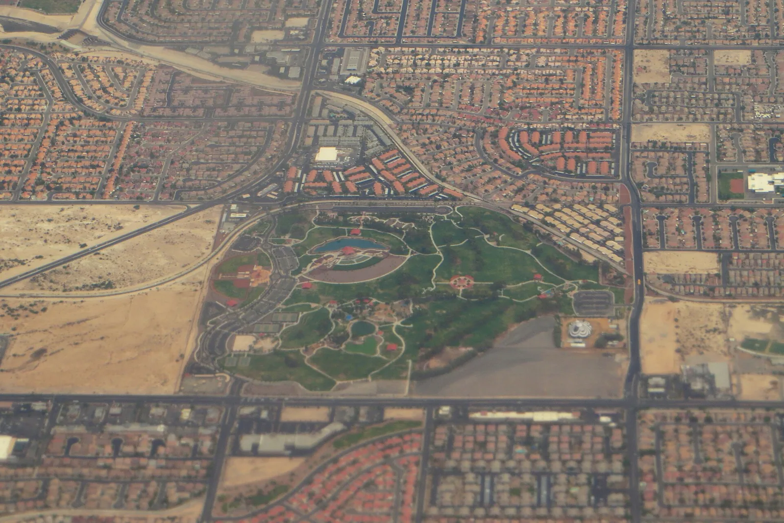 Aerial view of Craig Ranch Regional Park in North Las Vegas, ringed by tile-roofed subdivisions