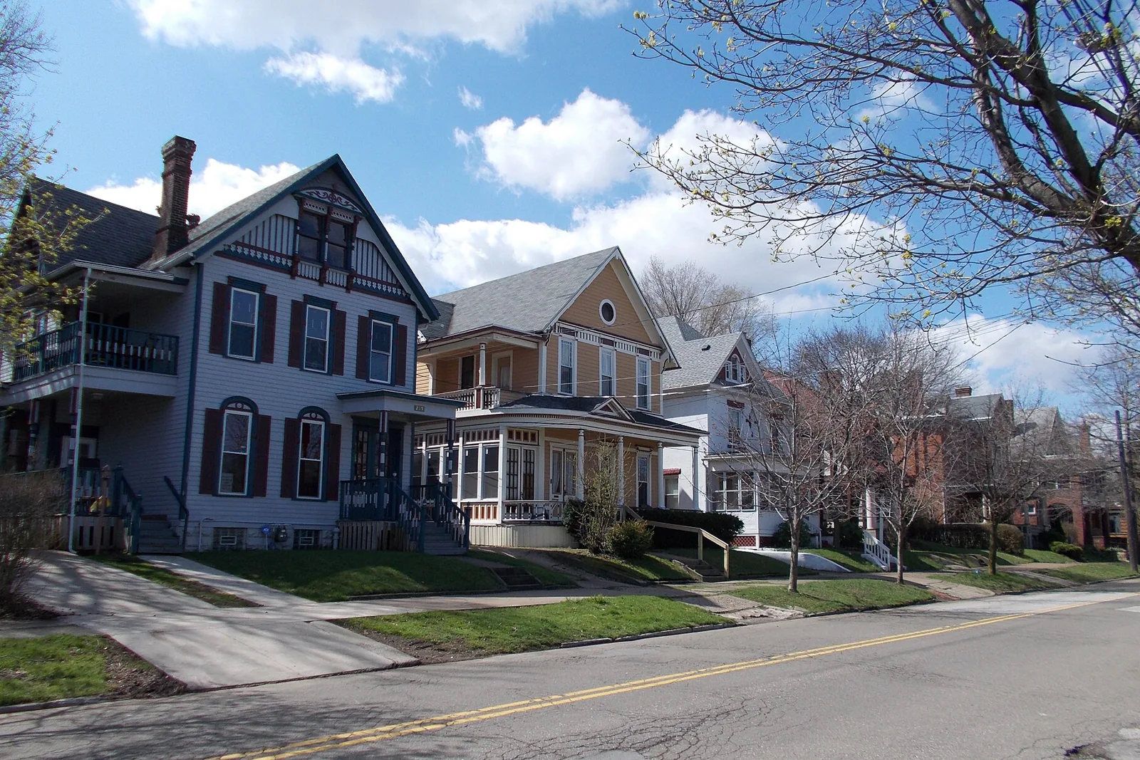 Victorian houses with deep porches along West 21st Street in Erie, Pennsylvania
