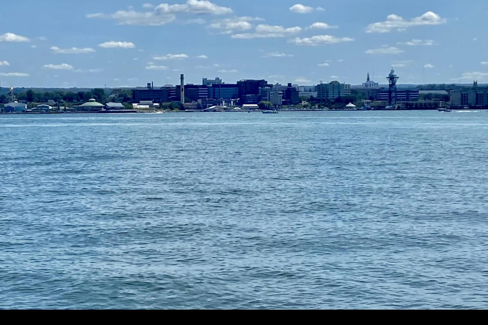 The downtown Erie, Pennsylvania skyline across Presque Isle Bay on a summer day