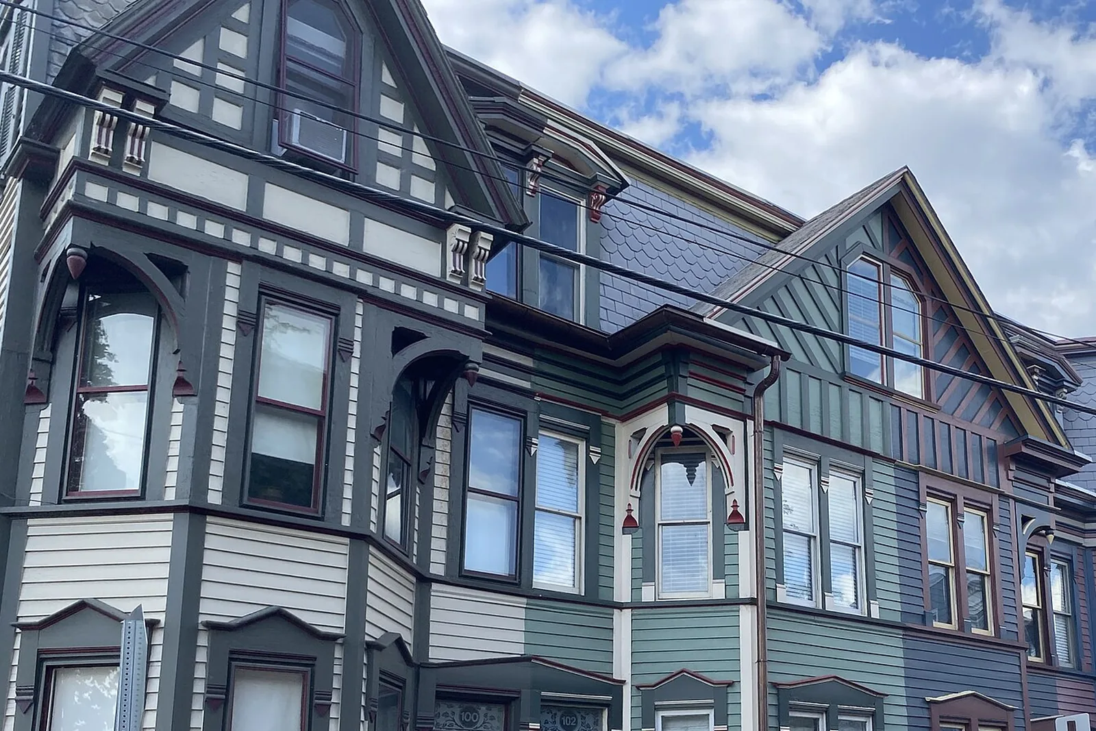 Painted Victorian rowhouse facades with bay windows and ornate trim in the Shipoke neighborhood of Harrisburg, Pennsylvania
