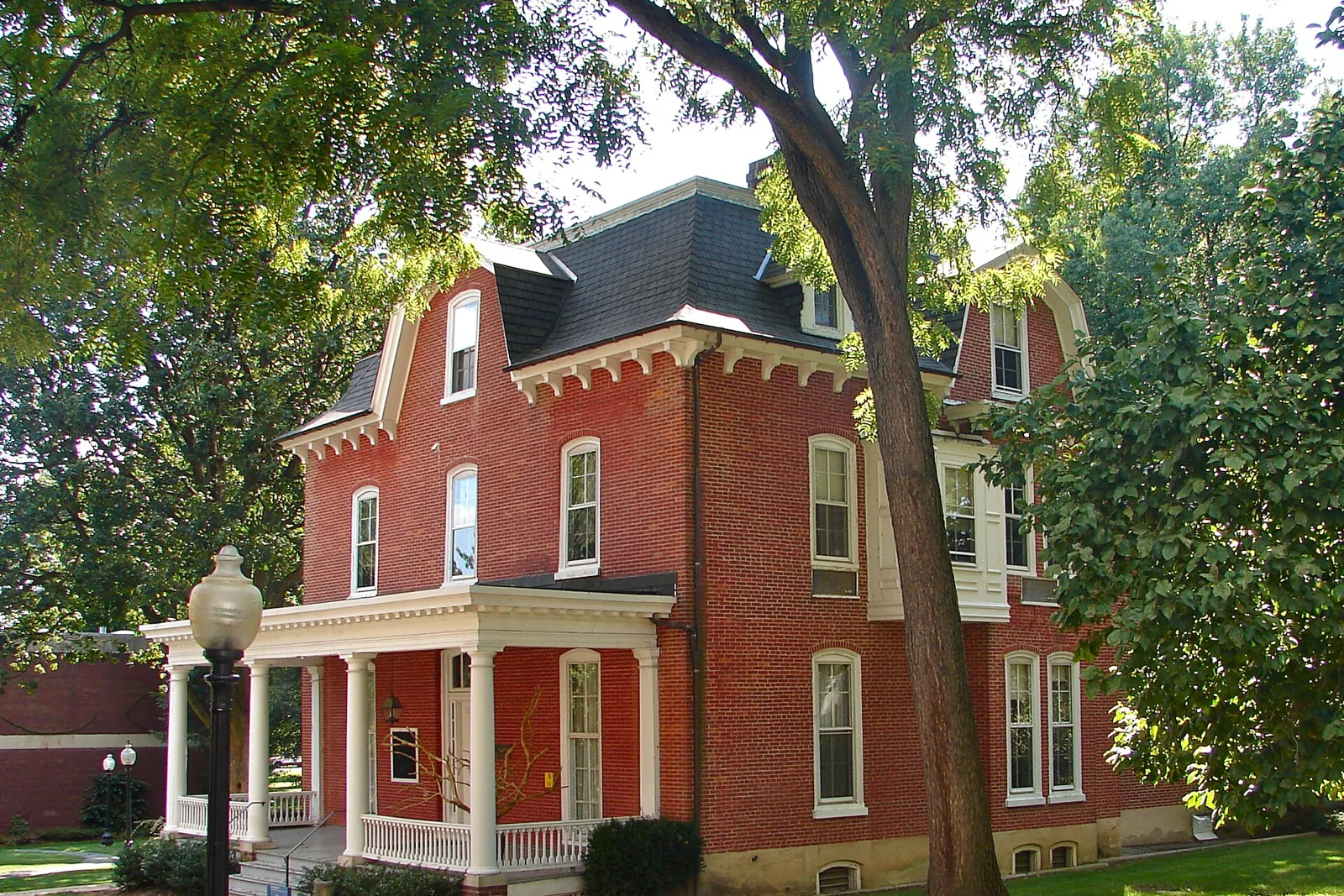 A three-story brick house with a mansard roof and a columned porch on the Franklin and Marshall College campus in Lancaster, Pennsylvania