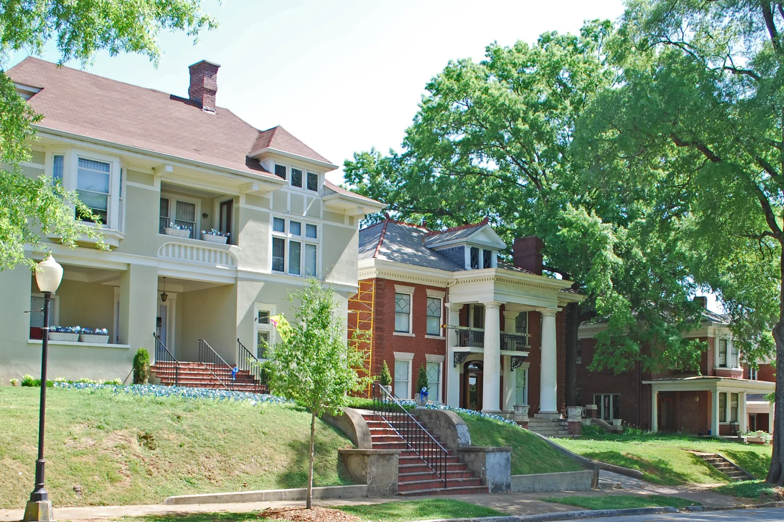 Two-story brick and stucco houses on a tree-lined street in the Fort Wood Historic District of Chattanooga