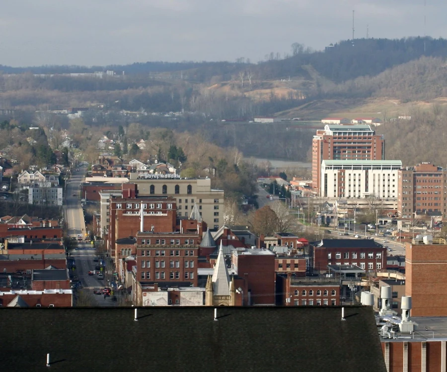 View over downtown Morgantown, West Virginia with the hills behind it
