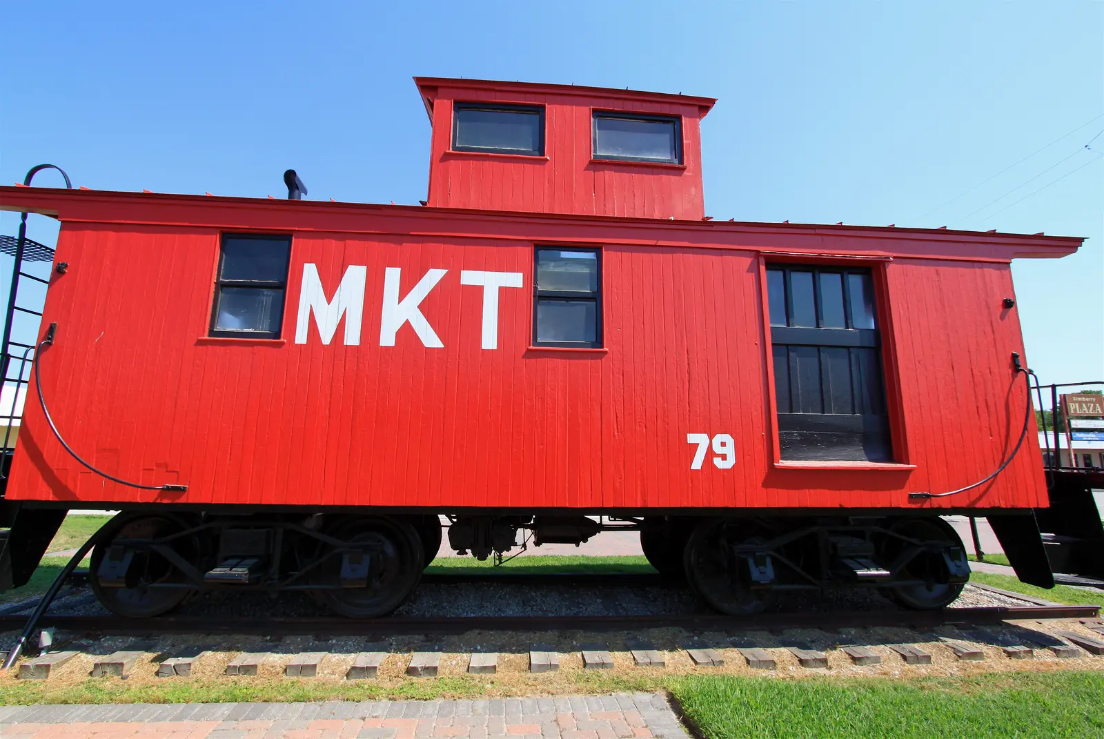 Red MKT railroad caboose on display in Old Katy Texas