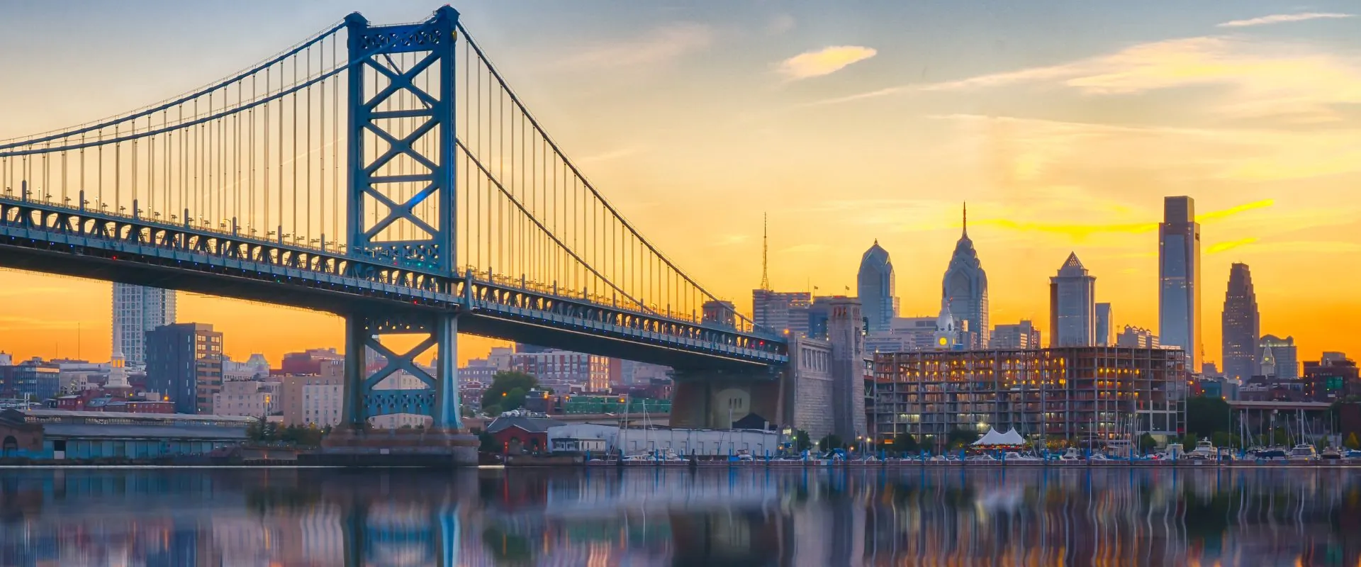 The Benjamin Franklin Bridge and the Center City Philadelphia skyline at sunrise