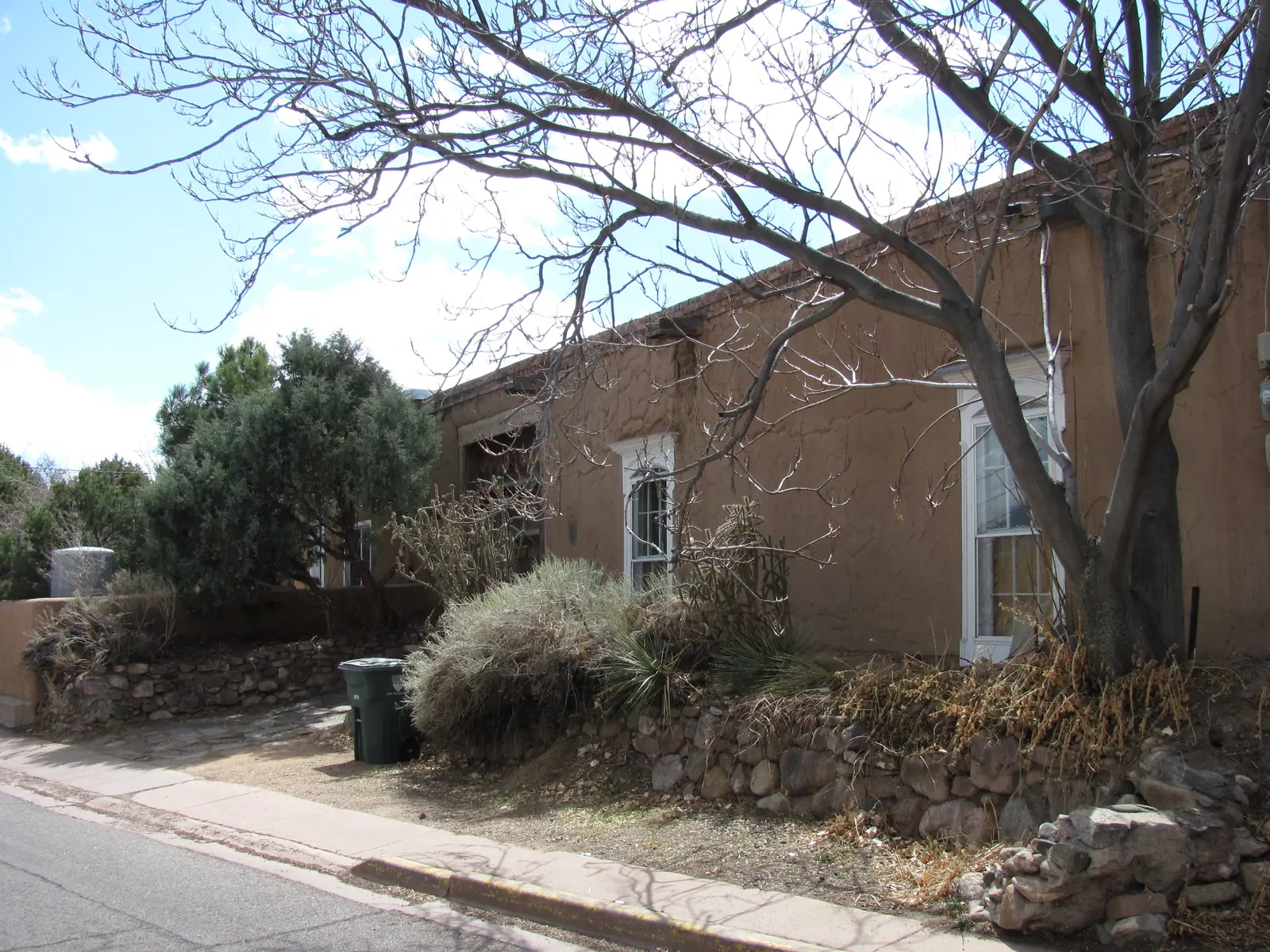A quiet street of postwar Territorial-style ranch houses in the Casa Solana area of Santa Fe