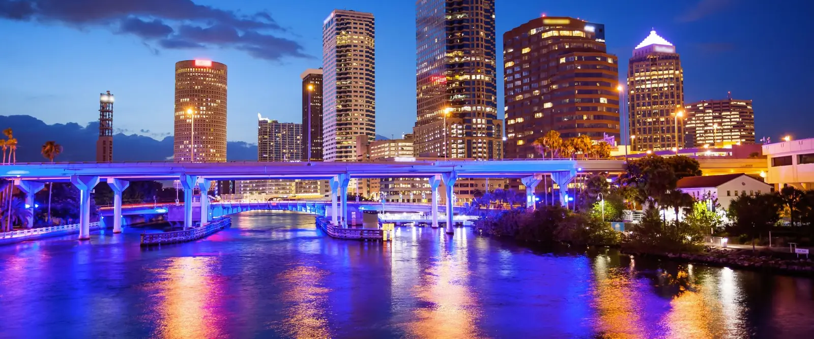 Downtown Tampa, Florida skyline over the Hillsborough River at night