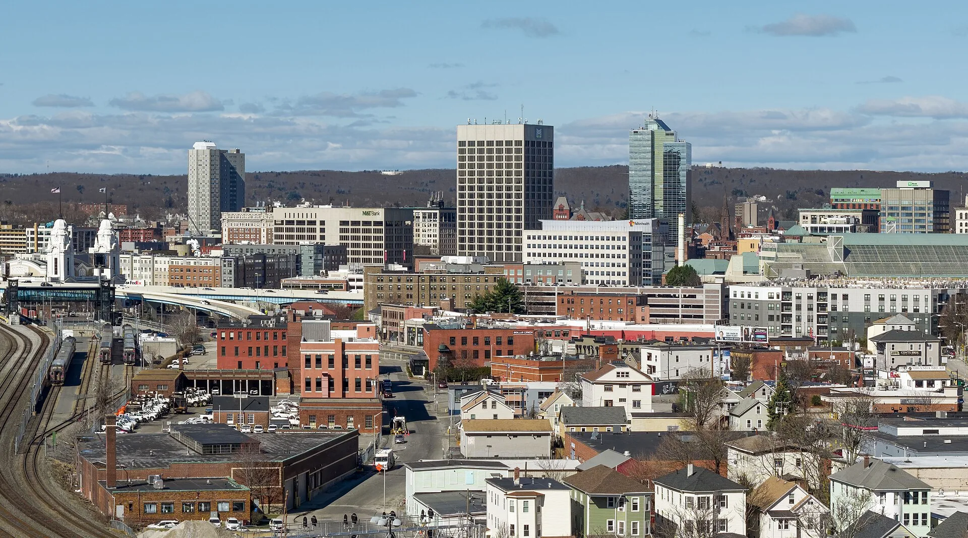 The downtown Worcester, Massachusetts skyline above the three-deckers and wood-frame houses of the neighborhoods below